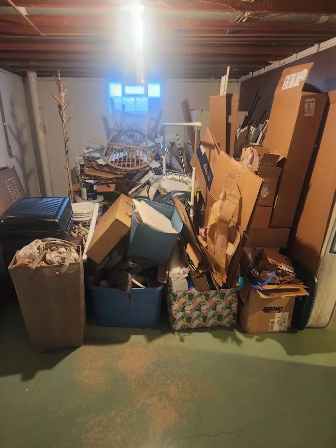 Roll-off dumpster container at job site for 8 Yard Dumpster Rental in Buxton